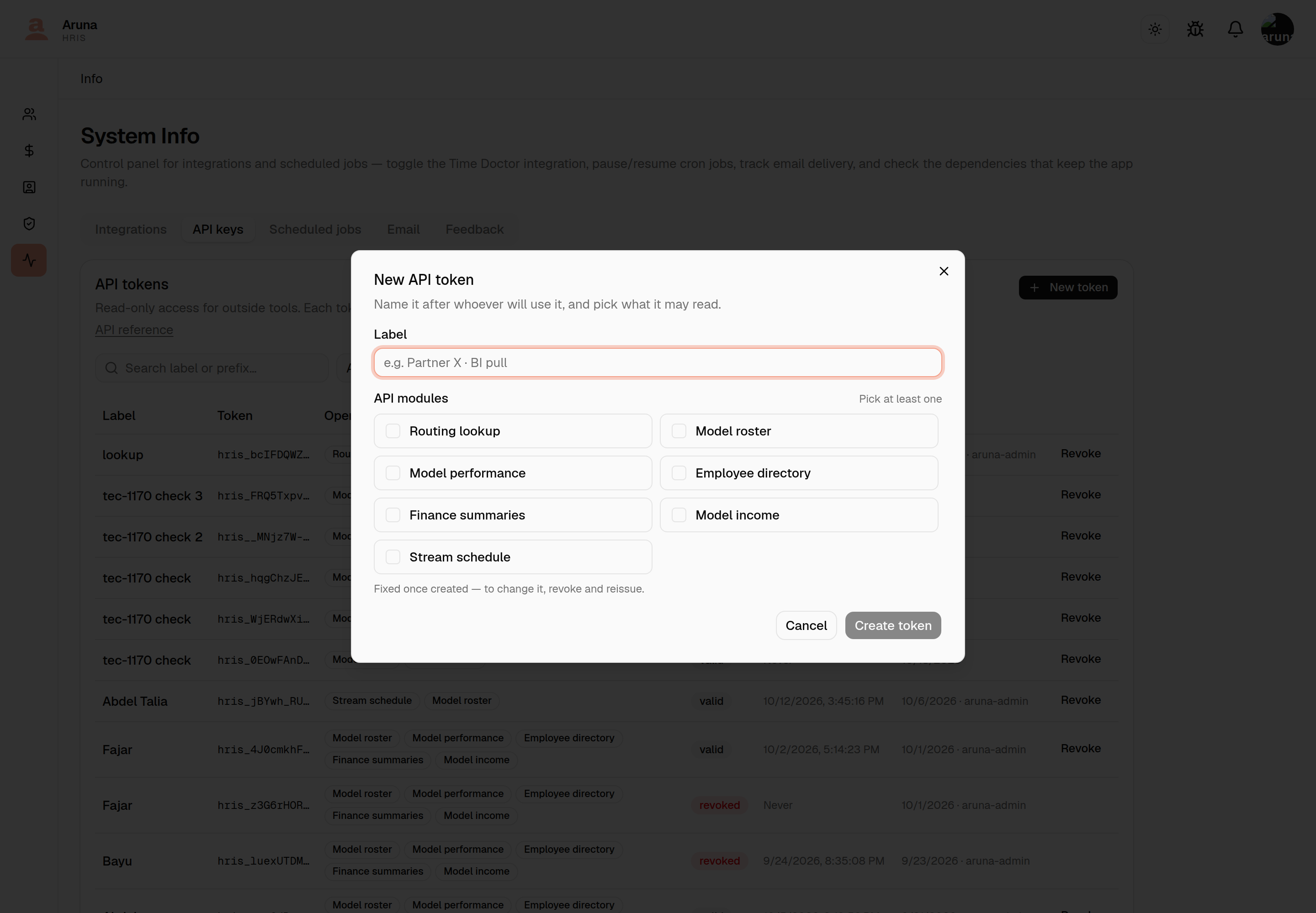 The New API token dialog: a Label field with the placeholder "e.g. Partner X · BI pull", an "API modules" section headed "Pick at least one" with seven unticked checkboxes — Routing lookup, Model roster, Model performance, Employee directory, Finance summaries, Model income and Stream schedule — a note reading "Fixed once created — to change it, revoke and reissue", and Cancel / Create token buttons.